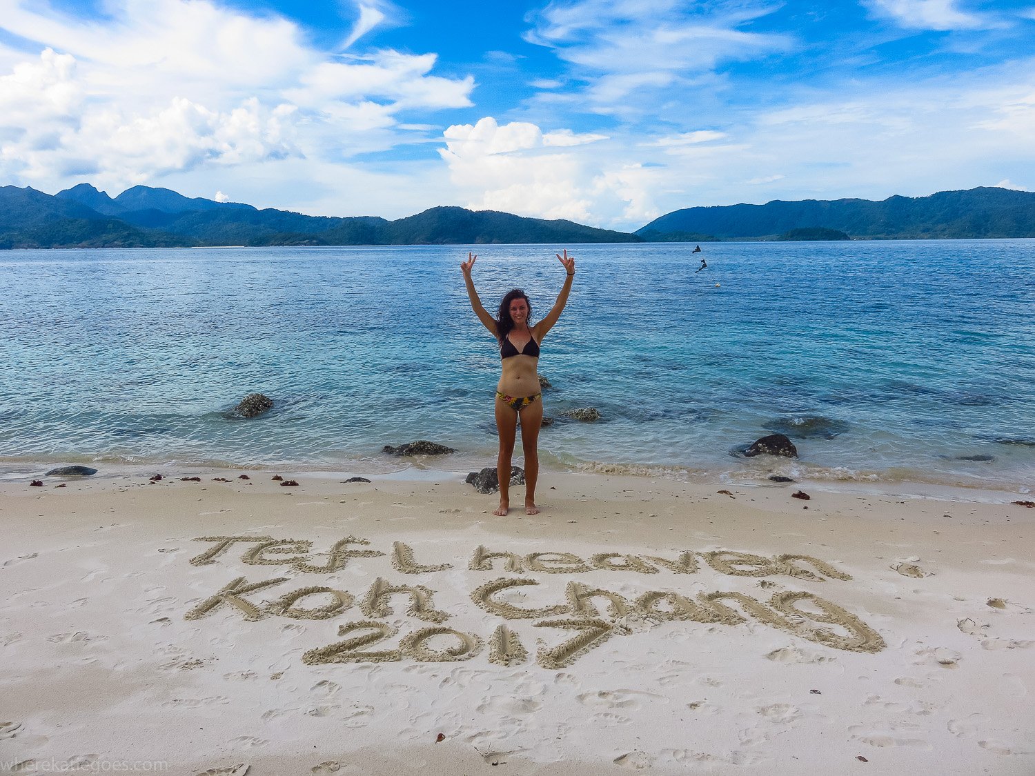 IMG\_4794 Woman on beach in Thailand with “TEFL Heaven Koh Chang 2017” written in sand